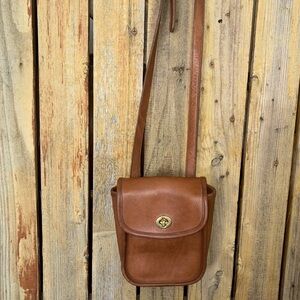 Coach Tan Leather Shoulder Bag with Classic Flap Design